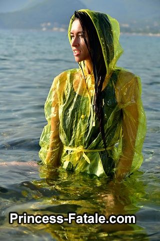 With PVC raincoat in the sea