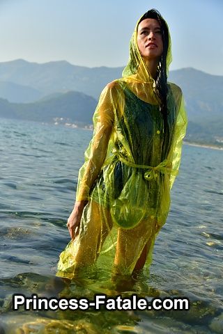 With PVC raincoat in the sea